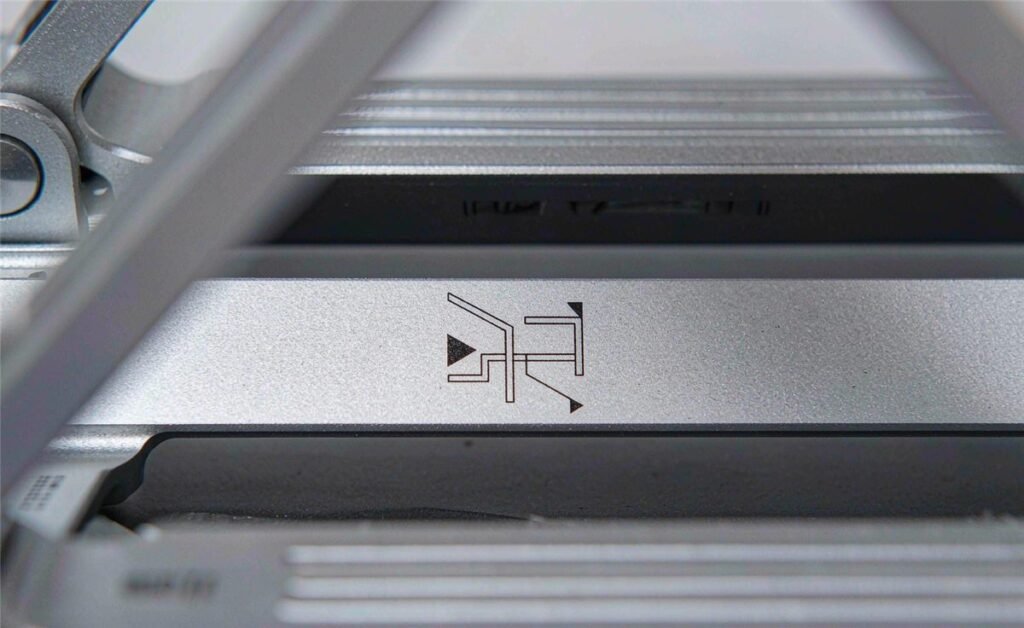 Laser engraved custom logo on anodized aluminum laptop stand surface